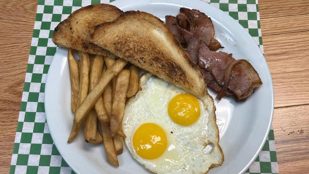 Breakfast Plate · 2 eggs, toasts, potatoes. ham or bacon.