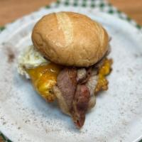 Breakfast Sandwich · Tuscan Bread, Egg, Cheese, Butter, Bacon or Ham