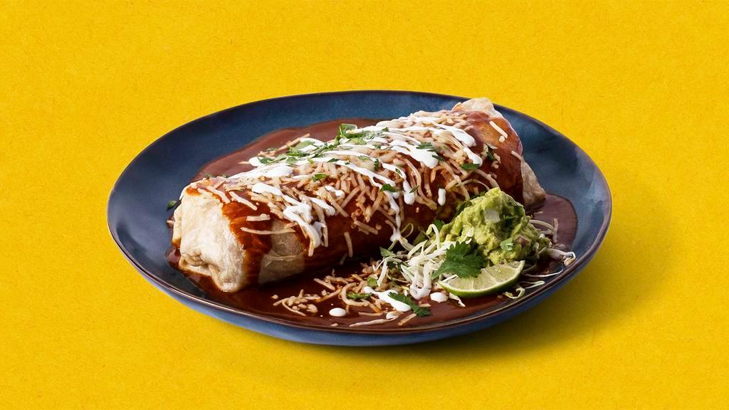 Super Burrito Burracho · Burrito with your choice of meat, rice, beans, lettuce, and pico de gallo, topped with salsa roja, sour cream, guacamole, and melted cheese
