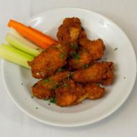 Hot Wings · Breaded, dry, crispy Louisiana-style hot wings, with celery, and bleu cheese-horseradish dre...