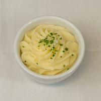Roasted Garlic Mashed Potatoes · Creamy roasted garlic mashed potatoes made in house daily