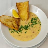 Clam Chowder · New England-style with clams, bacon, diced potatoes, cream, and fresh herbs, with grilled br...