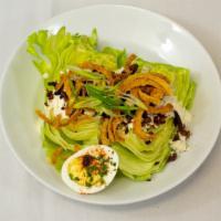 Wedge Salad · Iceberg lettuce, bleu cheese-horseradish dressing, chopped egg, bacon, fried onions, bleu ch...
