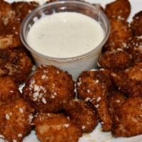 Garlic Parm Cauliflower · Cauliflower florets  beer battered, then rolled in panko and fried till crispy brown, tossed...