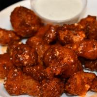 Buffalo  Cauliflower · Cauliflower florets  beer battered, then rolled in panko and fried till crispy brown. then t...