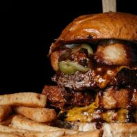 Double Jalapeño Burger · Delicious Burger made with 2 beef patties, jalapeños, lettuce, tomatoes, and onion. Served i...