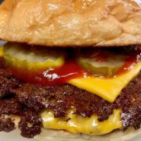 Little Cheeseburger · 1/8 lb ground beef, American cheese, ketchup, pickles.