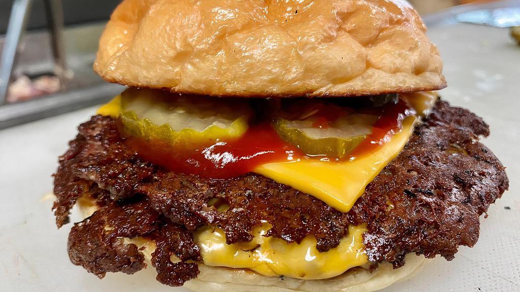 Little Cheeseburger · 1/8 lb ground beef, American cheese, ketchup, pickles.