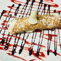 Cannoli · Cinnamon flaky crust filled with chocolate chips and sweet ricotta