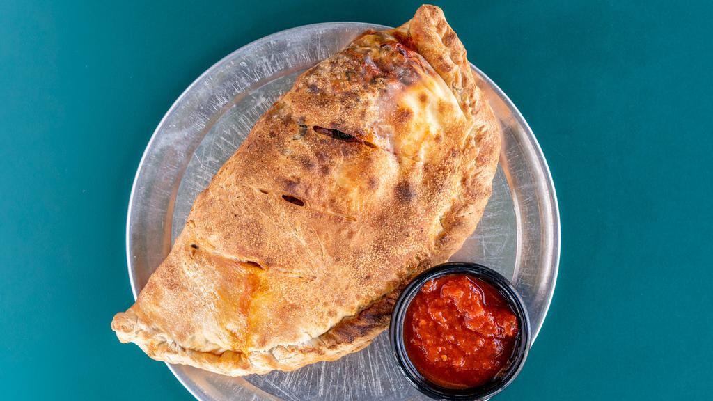 Specialty Calzone · All calzones are filled with mozzarella and ricotta and served with a side of marinara. Select a specialty calzone or build your own.