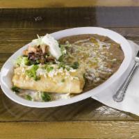 Chimichanga Dinner · A large flour tortilla stuffed with your choice of shredded chicken or beef, deep fried to a...