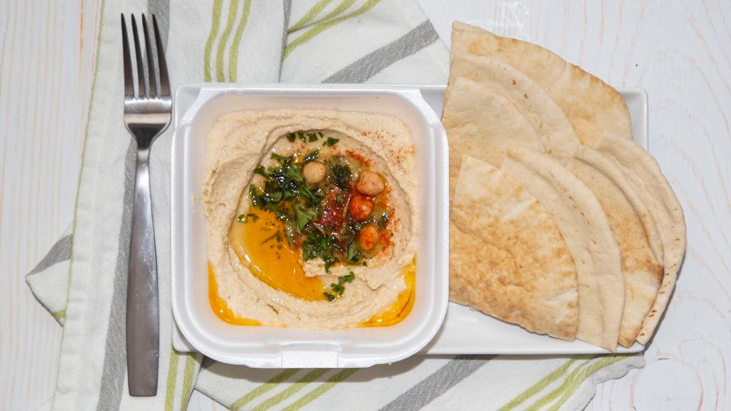 Hummus · Garbanzo bean dip with olive oil; served with pita bread.
