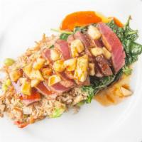 Seared Ahi · Sesame crusted sushi grad ahi tuna over mixed greens with cabbage, red onion, carrot, and ed...