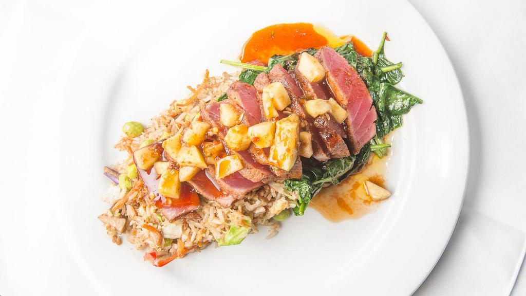 Seared Ahi  · togarashi-crusted ahi loin, mixed greens, cabbage, red onion, shredded carrot, edamame, pickled heart of cucumber, wasabi-soy dressing. 

Served raw or lightly cooked. Consuming raw or undercooked meats, poultry, seafood, shellfish, or eggs may increase your risk of foodborne illness.