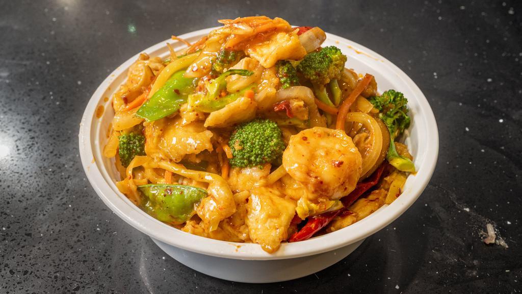 Double Happiness · Hot and spicy. Large. Combination of shrimp and chicken with garlic and ginger sautéed in a mild sauce over rice.
