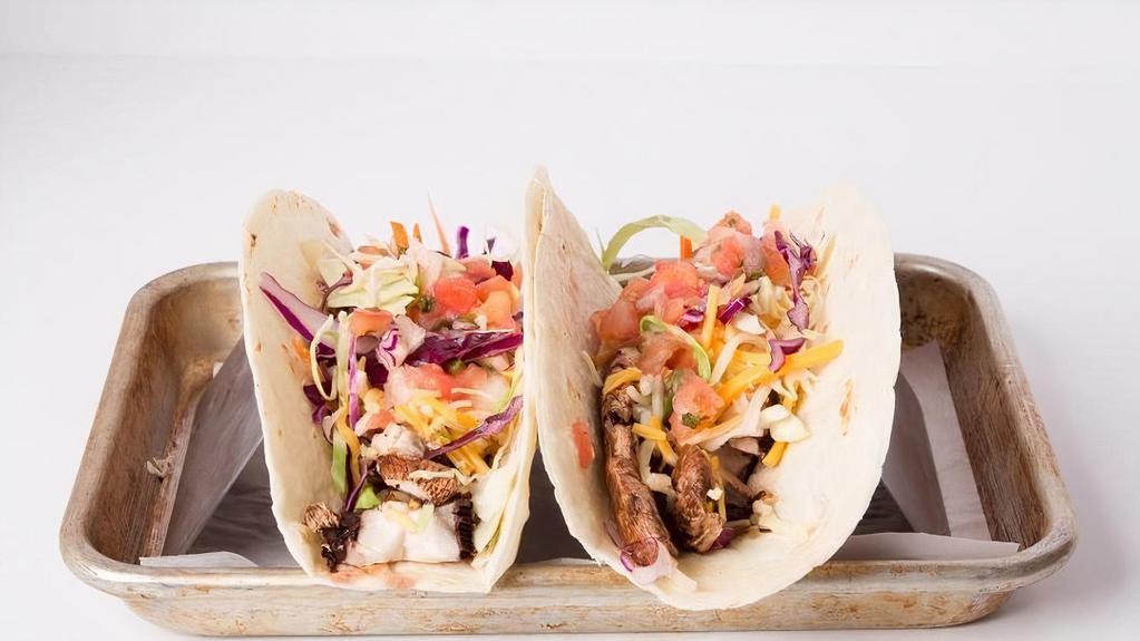Taco Mix (2) · Choice Flour Tortilla Or Lettuce Shell, Choice 2 Protein Mix or Match, Steak, Chicken, Carnitas, Portobello, Smoked Salmon.  Topped With Mexican Cheese, Cabbage Blend, And Pico.