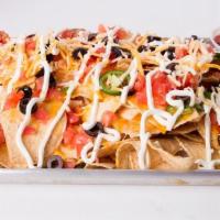Nachos · Tortilla Chips, Topped With Mexican Cheese, Mozzarella Cheese, Fresh Jalapeno, Diced Tomato,...
