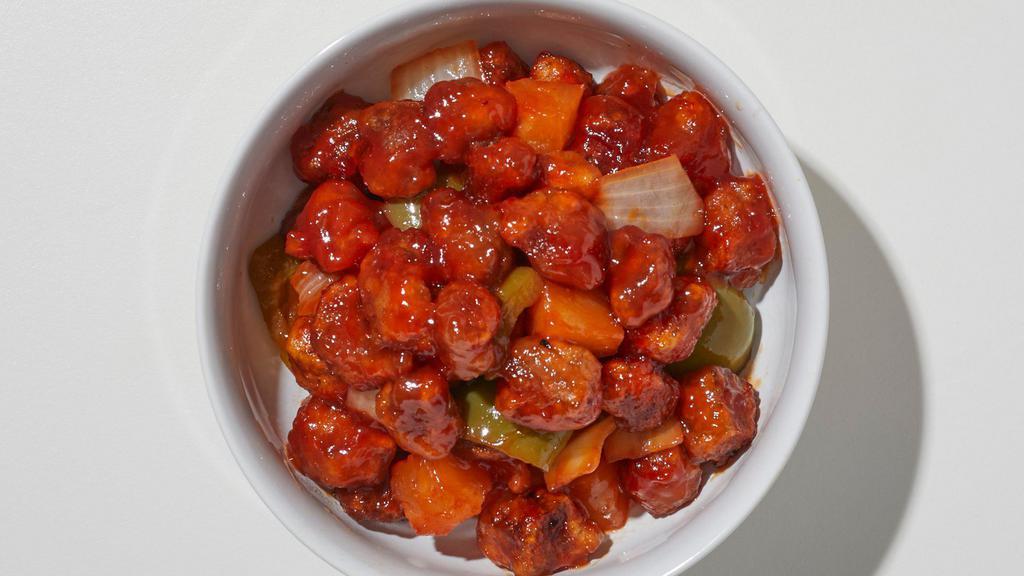 Sweet And Sour Pork · Deep fried battered pork covered with sweet and sour sauce, pineapple, carrots, bell pepper and white onions.