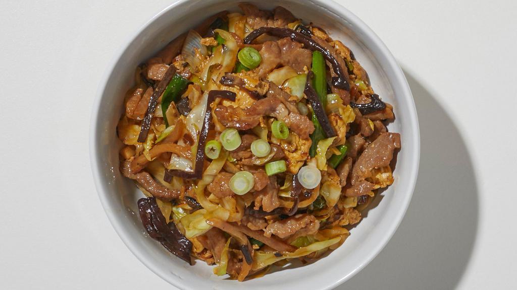 Mushu Pork · Shredded pork, cabbage, white onions, julienned wood ear mushroom, bamboo shoots, carrots, and egg, served with mandarin pancakes and hoisin sauce.