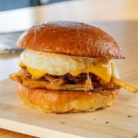 Brunch Burger · 1/4 pound dry aged beef, cooked medium, crispy fries, american cheese, cage free runny egg a...