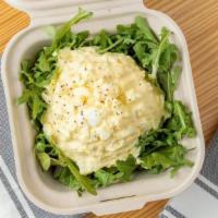 Egg Salad · chilled cage free hard cooked eggs, mixed in mayo on a bed of dressed organic baby arugula