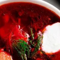 Borscht · Soup made with beef, beets, cabbage, potatoes, carrots and bay leaves. Served with a side of...
