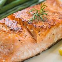 Grilled Salmon · Salmon steaks, seasoned and grilled.  Served with a side of rice or potato(tossed in olive p...