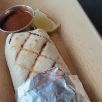 Carnitas Burrito · Traditional citrus, guajillo & garlic-braised pork, pickled red onions, pico de gallo, sour ...