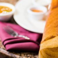 Ghee Roast Dosa (Gluten Free) · Thin rice crepe cooked in ghee.