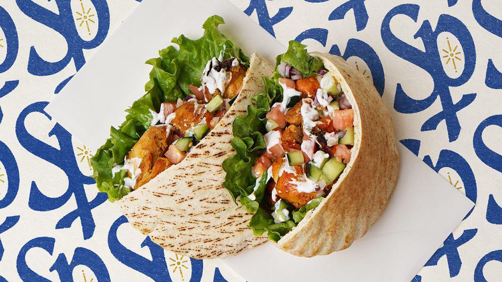 Chicken Kabob Pita · Marinated chicken breast with lettuce, tomatoes, cucumber, onions, and your choice of sauce wrapped in a pita