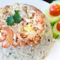 Crab Fried Rice · Thai jasmine rice stir fried with egg and onion in light sauce. Topped with crab and cilantro.