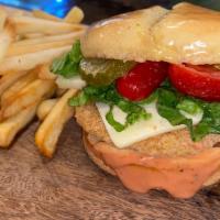 Clucker Deluxe · Delicious breaded chicken breast filet with lettuce, tomato, pickles, pepper jack cheese and...