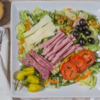 Anti Pasto · Lettuce, tomatoes, carrots, olives, peppers, ham, salami & cheese.