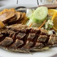 Veracruz Style Fish · Fried fish covered with Veracruz style salsa.