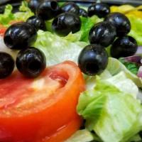 Dinner Garden Salad · Romaine and Iceberg Lettuce,  Black Olives, Cucumbers, Tomatoes, Red Onions and Pepperchini.