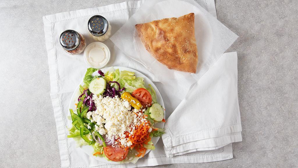 Greek Salad · Romaine & Iceberg Lettuce, Tomatoes, Onions, Green Bell Peppers, Cucumbers, Red Onions, Kalamata Olives, Black Olives, Pepperoncini, Green Olives & Feta Cheese, with your choice of dressing