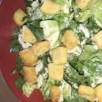 Naked Caesar Salad · Romaine, parmesan, garlic croutons and Caesar dressing.