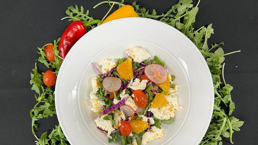 House Salad · Baby arugula, purple cabbage, cherry tomatoes, oranges, fresh mozzarella/feta with in-house Citrus Dressing