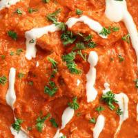Butter Chicken · Spiced tomatoes and butter gravy with chicken.