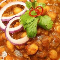 Chole Masala · chickpeas stew blended in spices. Served with Basmati rice.