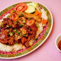 Steamed Rice With Bbq Shrimp, Bbq Pork, And Egg Roll · 