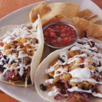Pan-Seared Blackened Tacos · Cabbage slaw, black beans, jalapeno-ginger aioli, queso fresco, sour cream, tortilla chips