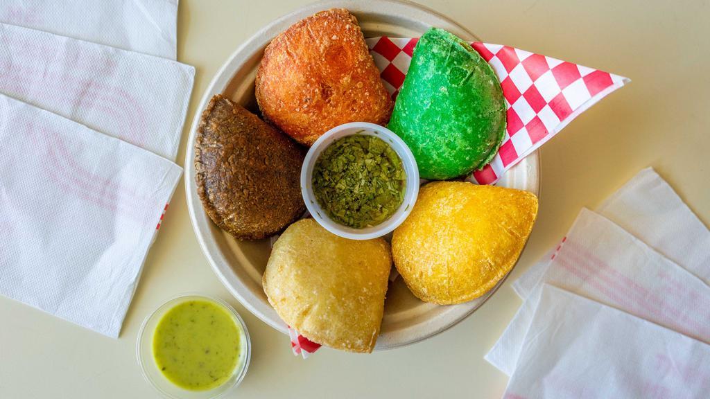 Empanada · Delicious, veggie or meat filled fried pastry. Every Empanada is color coded!