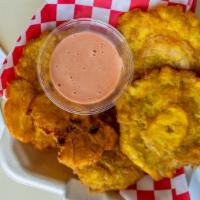 Mini Tostones Sides · Flat, fried, green plantain slices