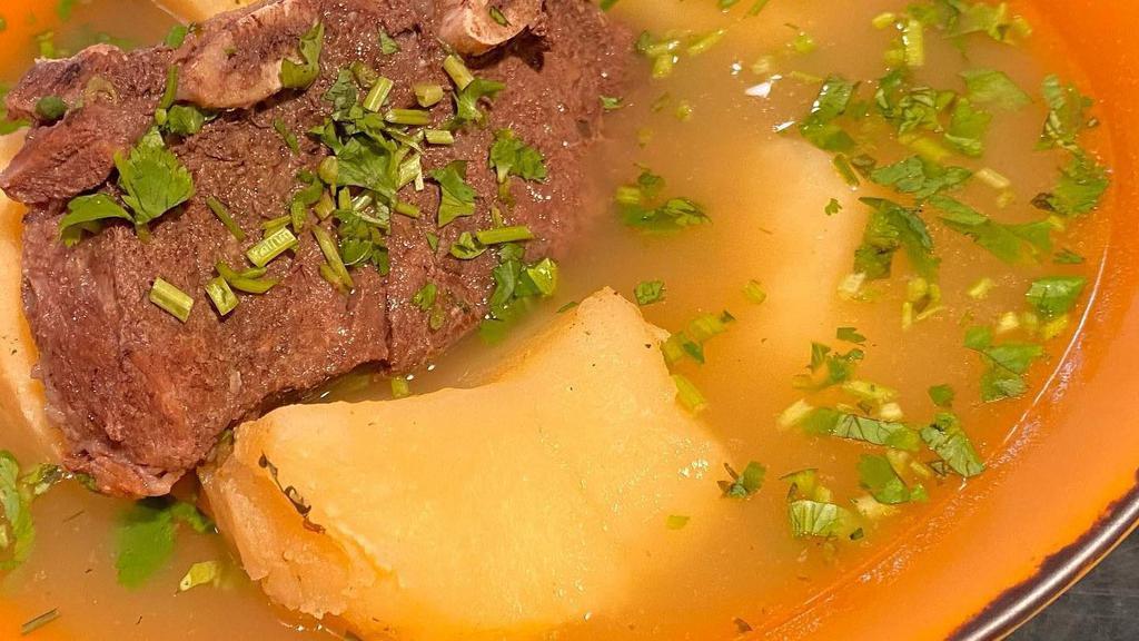 Hangover Soup (Caldo De Costilla) · Beef stew with potato, beef on the bone, onions and cilantro.