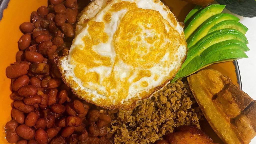 Frijolada Bowl · Like a MINI Bandeja Paisa, this bowl is protein filled with white rice, red beans, ground beef, sweet plantain slices, pork belly, small arepa and avocado.