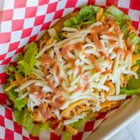 Toston Monta'O · Fried large plantain boat topped with lettuce, your choice of meat or beans, cheese and mayo...
