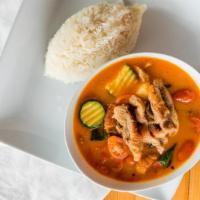 Duck Curry · Roasted duck red curry with pineapple, cherry tomato, zucchini, and thai eggplant.