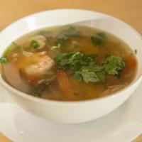 Tom Yum Soup · Gluten free. Spicy and sour soup (chicken broth) with mushroom, onion, tomato, galangal, lem...
