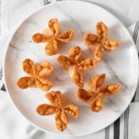 Crab Rangoon (6 Pcs.) · A combination of imitation crab meat, cream cheese and finely diced onion folded into a wont...